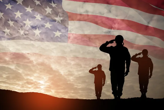 Remembering Our Veterans This Memorial Day - veterans near the flag