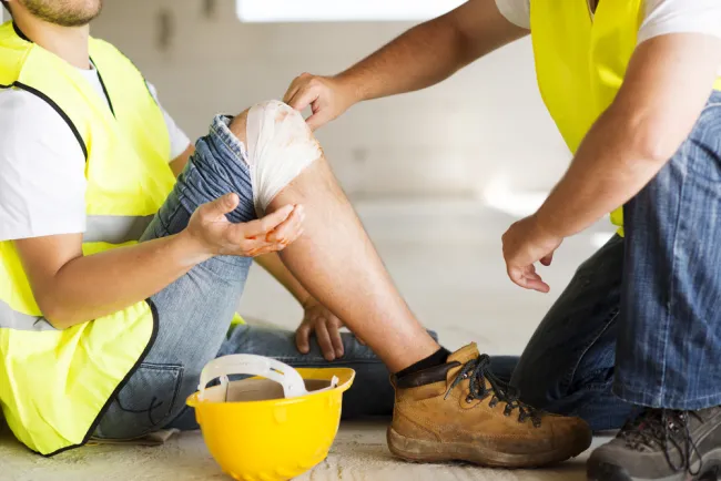 Understanding Personal Injury Protection (PIP) - worker injured his knee