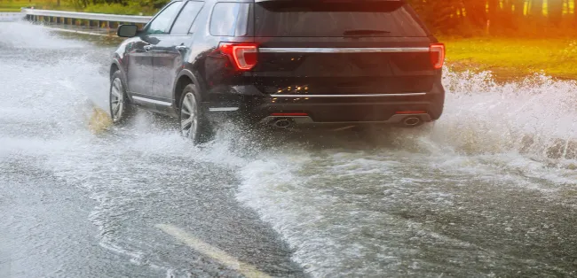 Car driving in flood